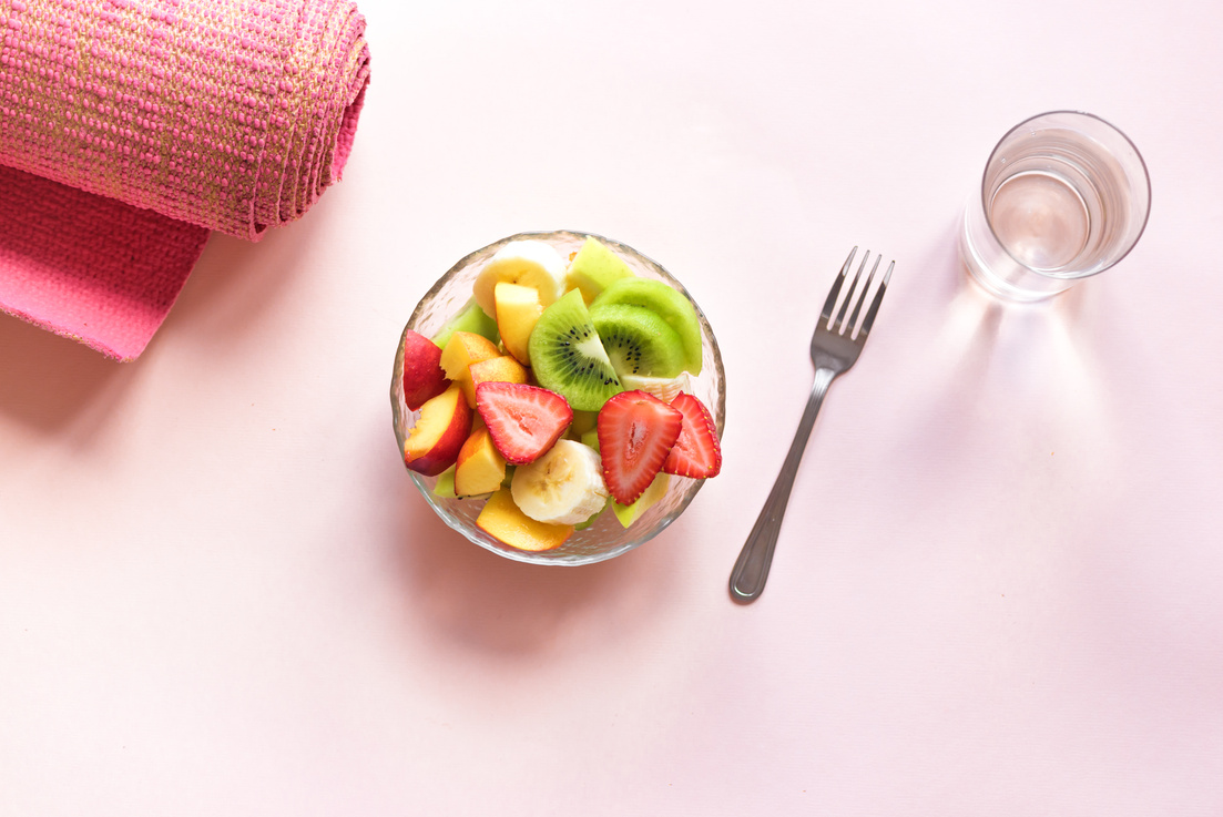 Pink yoga mat and Fruit Salad