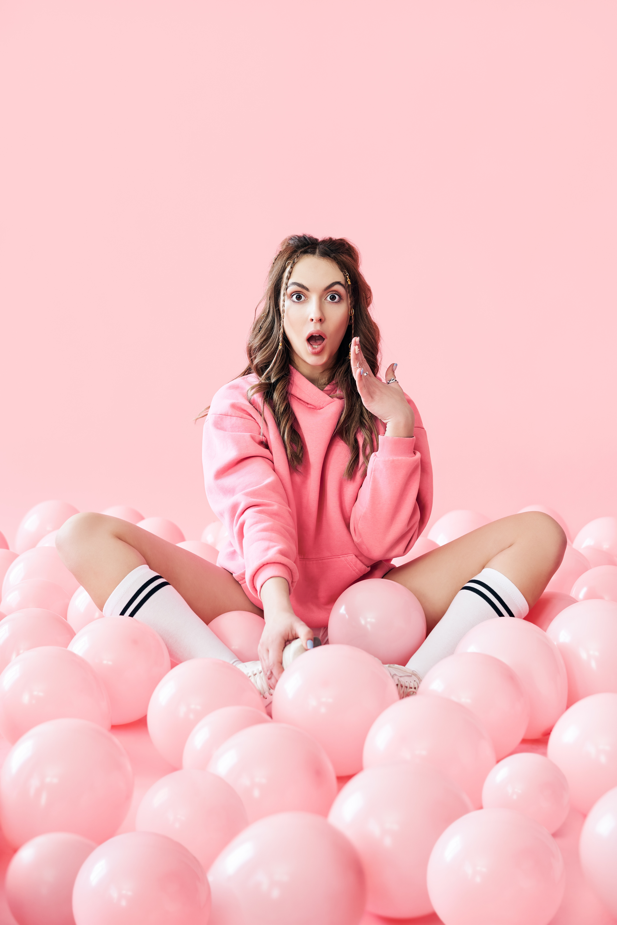 Fashionable Young Woman with Pink Balloons