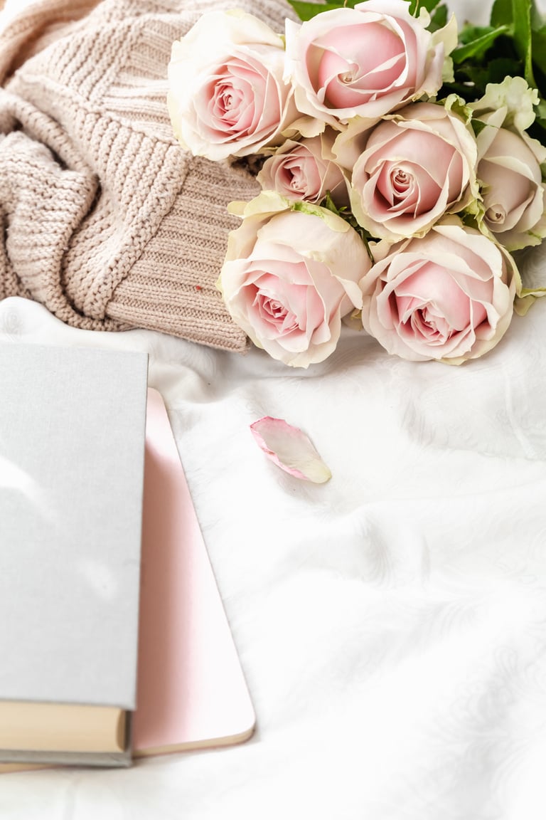 Pink Roses on a Bed